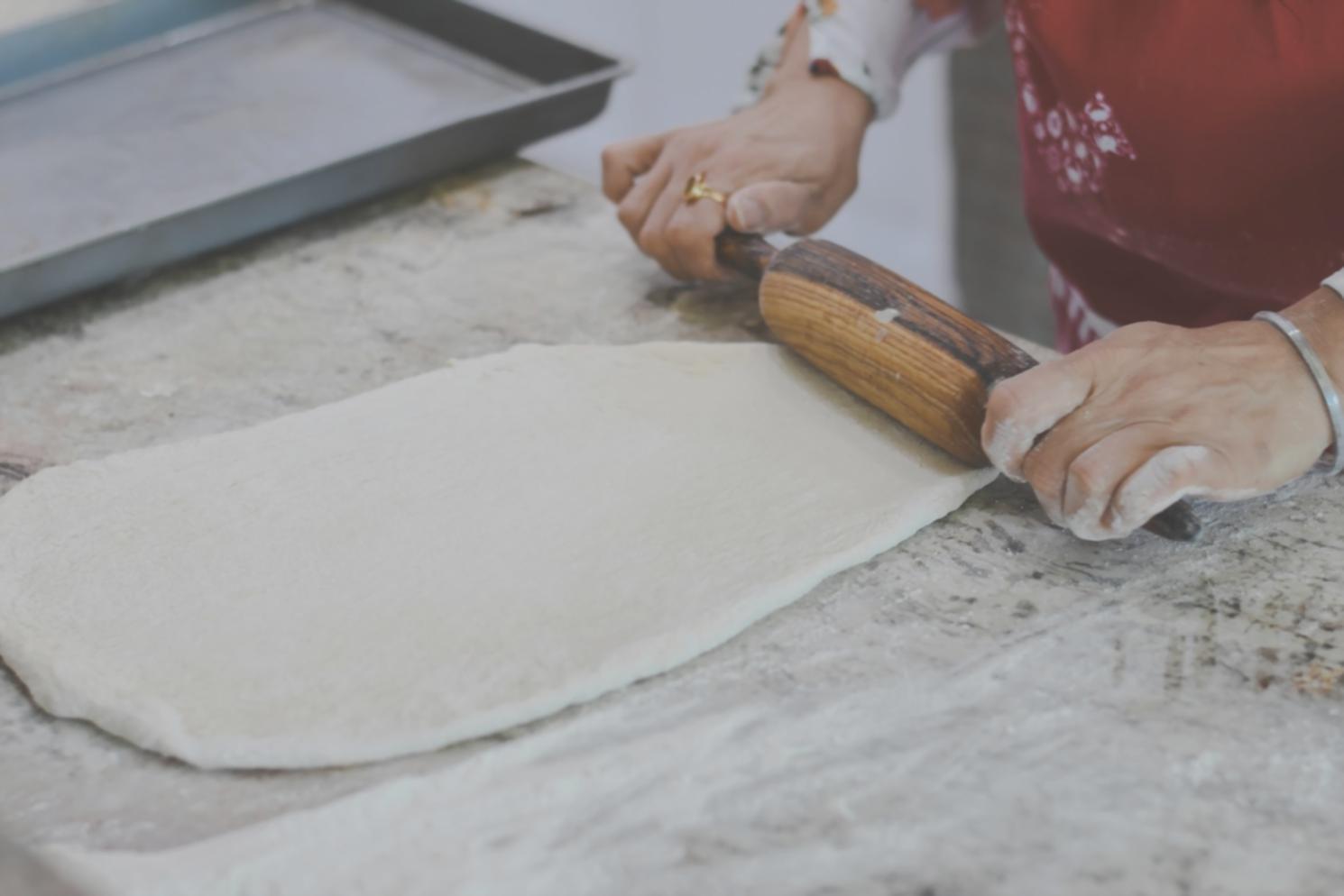 Creative cooking workspace with fresh ingredients and modern kitchen tools